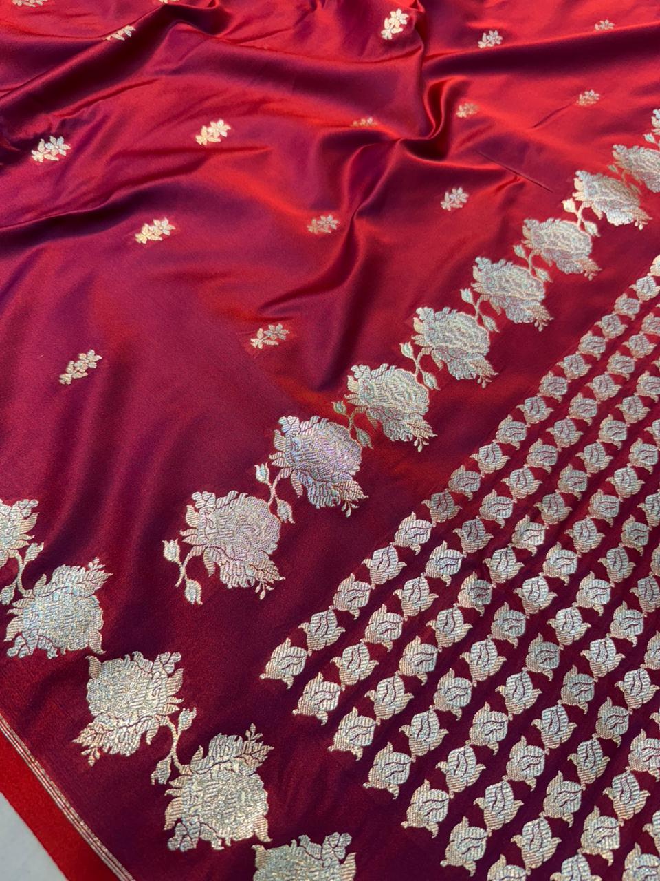 Red Mashru silk saree by Kalisa Banaras featuring intricate traditional designs and a rich, smooth texture.
