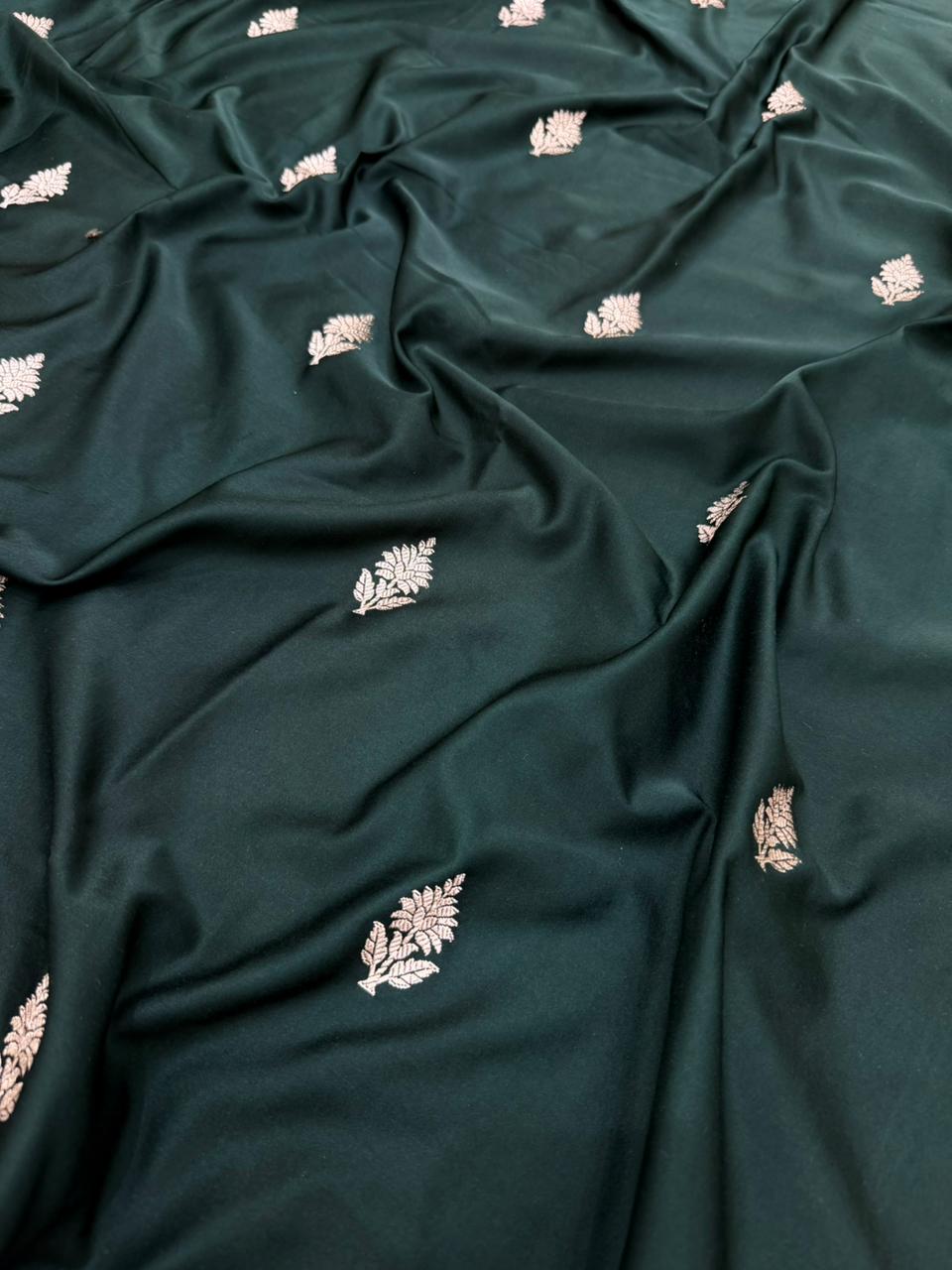 Dark green Mashru silk saree by Kalisa Banaras featuring traditional woven patterns and elegant draping.